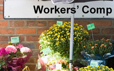 Photo of a small flower business with a workers' comp sign